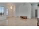 Inviting living room featuring tile floors, a chandelier, and a bright, welcoming atmosphere at 3750 Horseshoe Mesa St, Las Vegas, NV 89147