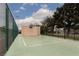 Outdoor basketball court with fresh white lines surrounded by a green fence and trees at 3871 Sinclair St, Las Vegas, NV 89121