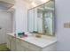 This bathroom includes a sink, vanity and a large, mirrored medicine cabinet at 3871 Sinclair St, Las Vegas, NV 89121