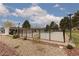 Fenced community pool area for residents' enjoyment, showing landscaping, a park and blue skies at 3871 Sinclair St, Las Vegas, NV 89121