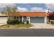 Charming single story home with orange tile roof, blue garage door, and well maintained front yard at 3871 Sinclair St, Las Vegas, NV 89121