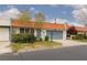 Charming single story home with orange tile roof, blue garage door, and well maintained front yard at 3871 Sinclair St, Las Vegas, NV 89121