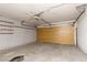 Spacious garage with a yellow door and high ceiling offering plenty of room for parking and storage at 3871 Sinclair St, Las Vegas, NV 89121