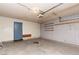 A spacious two car garage with cement flooring and built in shelving for storage at 3871 Sinclair St, Las Vegas, NV 89121