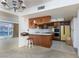 Open living space featuring classic kitchen with vintage appliances and breakfast bar seating at 3871 Sinclair St, Las Vegas, NV 89121