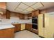 Classic kitchen featuring wood cabinetry, light countertops, and vintage appliances, full of charm at 3871 Sinclair St, Las Vegas, NV 89121