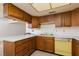 Classic kitchen featuring wood cabinetry, light countertops, and vintage appliances, ready for remodel at 3871 Sinclair St, Las Vegas, NV 89121