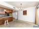 Open living space featuring classic kitchen with vintage appliances and breakfast bar seating at 3871 Sinclair St, Las Vegas, NV 89121