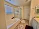 Bright bathroom with tub, shower, and vanity with ample counter space at 4046 Sparrow Rock St, Las Vegas, NV 89129