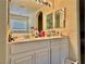 Bathroom featuring double sink vanity, ample counter space, and neutral colors at 4046 Sparrow Rock St, Las Vegas, NV 89129