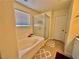 Bright bathroom with tub, shower, and vanity with ample counter space at 4046 Sparrow Rock St, Las Vegas, NV 89129
