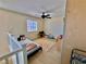 Cozy bedroom area with a single bed, ceiling fan, and laminate wood flooring at 4046 Sparrow Rock St, Las Vegas, NV 89129