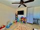 Bright bedroom with a ceiling fan, gray storage cabinets, and laminate wood flooring at 4046 Sparrow Rock St, Las Vegas, NV 89129