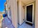 Close-up of home entrance with a decorative light fixture and a well-maintained brick walkway at 4046 Sparrow Rock St, Las Vegas, NV 89129
