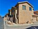 Charming townhome showcasing a two-story design with a well-kept desert landscape and a red tiled roof at 4046 Sparrow Rock St, Las Vegas, NV 89129