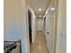 Hallway showcasing recessed lighting, laminate wood flooring, and multiple doorways at 4046 Sparrow Rock St, Las Vegas, NV 89129