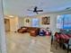 Spacious living room featuring a large sectional sofa, contemporary decor, and ample natural light at 4046 Sparrow Rock St, Las Vegas, NV 89129
