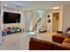Inviting living room with a staircase, open floor plan, and plenty of space for entertaining at 4046 Sparrow Rock St, Las Vegas, NV 89129