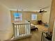 Loft area with natural light, wood-look floors, and chandelier at 4046 Sparrow Rock St, Las Vegas, NV 89129