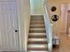 Inviting staircase with light wood treads, white risers, and a white handrail at 4046 Sparrow Rock St, Las Vegas, NV 89129