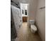 This is a bathroom with a toilet and shower with granite tile at 4239 White Sands Ave, Las Vegas, NV 89121