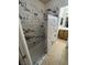 This is a bathroom with a granite tile shower and vanity with brown cabinets at 4239 White Sands Ave, Las Vegas, NV 89121
