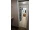 This is a bathroom with granite tile in the shower and brown cabinet vanity at 4239 White Sands Ave, Las Vegas, NV 89121