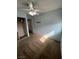 This bedroom features light blue walls, tan carpet, and mirrored closet at 4239 White Sands Ave, Las Vegas, NV 89121