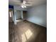 This bedroom features light blue walls, tan carpet, and mirrored closet doors at 4239 White Sands Ave, Las Vegas, NV 89121