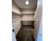 This is a bedroom closet with shelving and brown carpet at 4239 White Sands Ave, Las Vegas, NV 89121