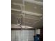 This garage features a large door, an overhead light, and a garage door opener at 4239 White Sands Ave, Las Vegas, NV 89121