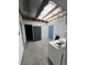 Bright laundry room with washer, dryer, storage cabinets, and natural light from the corrugated, translucent roof at 4239 White Sands Ave, Las Vegas, NV 89121