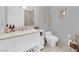 Chic bathroom featuring a white vanity, toilet, and decorative accessories at 4471 Dean Martin Dr # 2204, Las Vegas, NV 89103