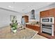 Bright kitchen featuring stainless steel appliances, an island, and dark wood cabinets and drawers at 4471 Dean Martin Dr # 2204, Las Vegas, NV 89103