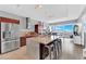 Modern kitchen featuring stainless steel appliances and a large island with counter seating and a beautiful city view at 4471 Dean Martin Dr # 2204, Las Vegas, NV 89103