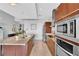 Bright kitchen featuring stainless steel appliances, an island, and dark wood cabinets and drawers at 4471 Dean Martin Dr # 2204, Las Vegas, NV 89103