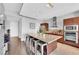 Bright kitchen features an island with seating, modern appliances, and dark wood cabinets and drawers at 4471 Dean Martin Dr # 2204, Las Vegas, NV 89103