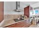 Kitchen featuring countertop appliances and dark wood cabinets and drawers with a living room in the background at 4471 Dean Martin Dr # 2204, Las Vegas, NV 89103