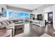 Living room featuring modern furniture, a television, and a window with a beautiful city view at 4471 Dean Martin Dr # 2204, Las Vegas, NV 89103