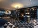 Relaxing lounge space with a fireplace, custom lighting, and striking flooring at 4471 Dean Martin Dr # 2204, Las Vegas, NV 89103