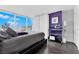 Modern main bedroom with city views from a large window at 4471 Dean Martin Dr # 2204, Las Vegas, NV 89103