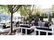 Lush patio area with lounge seating and manicured trees at 4471 Dean Martin Dr # 2204, Las Vegas, NV 89103