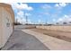 Wide shot of the backyard with concrete section and empty space for personalization at 4562 Scott Ave, Las Vegas, NV 89102