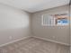 Cozy bedroom with carpet flooring, neutral paint, and natural light at 4562 Scott Ave, Las Vegas, NV 89102