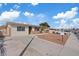 Exterior view of a single-story home with desert landscaping and a private driveway at 4562 Scott Ave, Las Vegas, NV 89102