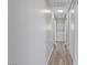 Hallway with wood-look flooring and neutral paint at 4562 Scott Ave, Las Vegas, NV 89102