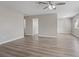 Bright living room featuring sleek flooring, neutral paint, and a modern ceiling fan at 4562 Scott Ave, Las Vegas, NV 89102