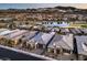 A high-angle view showcases the property's prime location within a community near a lake and golf course at 51 Reflection Cove Dr, Henderson, NV 89011