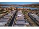Stunning aerial view showcasing a luxury community with a lake, golf course, and beautiful homes at 51 Reflection Cove Dr, Henderson, NV 89011