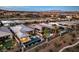 Aerial view of backyard featuring a modern pool with a spa and an outdoor living space at 51 Reflection Cove Dr, Henderson, NV 89011